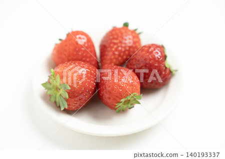 Strawberries in a glass container against a white background 140193337