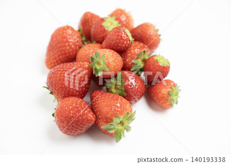Strawberries in a glass container against a white background Strawberries in a glass container against a white background 140193338
