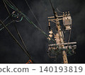 The silent silhouettes of utility poles and power lines stretching into the night sky. 140193819