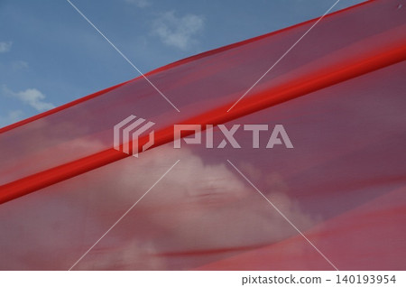 Red Color Cloth Flying In Wind Red Color Cloth Flying In Wind 140193954