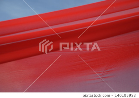 Red Color Cloth Flying In Wind Red Color Cloth Flying In Wind 140193958