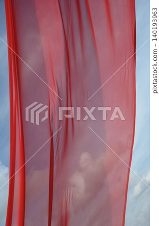 Red Color Cloth Flying In Wind Red Color Cloth Flying In Wind 140193963