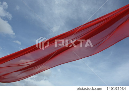 Red Color Cloth Flying In Wind Red Color Cloth Flying In Wind 140193984