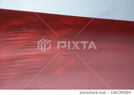 Red Color Cloth Flying In Wind Red Color Cloth Flying In Wind 140194004