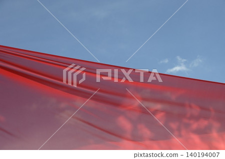 Red Color Cloth Flying In Wind Red Color Cloth Flying In Wind 140194007