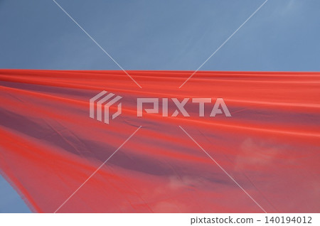 Red Color Cloth Flying In Wind Red Color Cloth Flying In Wind 140194012