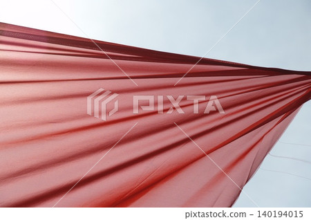 Red Color Cloth Flying In Wind Red Color Cloth Flying In Wind 140194015
