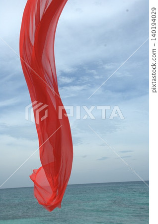 Red Color Cloth Flying In Wind Red Color Cloth Flying In Wind 140194029