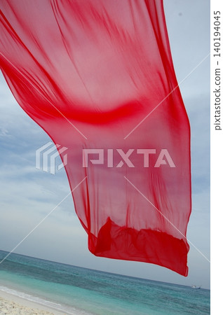 Red Color Cloth Flying In Wind 140194045