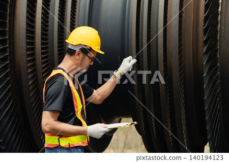 Professional engineer male working service power plant turbine fan blade electrical generator Professional engineer male working service power plant turbine fan blade electrical generator 140194123