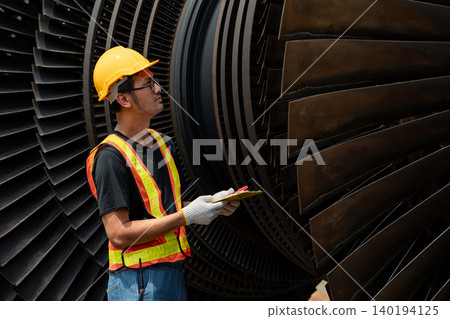 Professional engineer male working service power plant turbine fan blade electrical generator 140194125