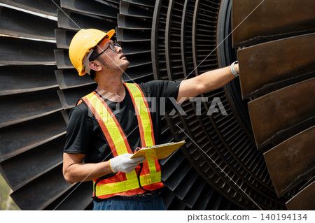 Professional engineer male working service power plant turbine fan blade electrical generator 140194134