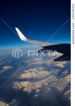 aircraft flying over snowed mountains of Pyrenees aircraft flying over snowed mountains of Pyrenees 140194281
