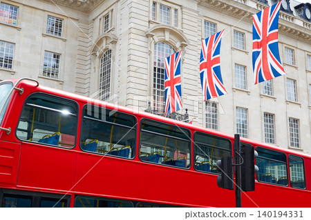 London Bus and UK flags in Piccadilly Circus London Bus and UK flags in Piccadilly Circus 140194331
