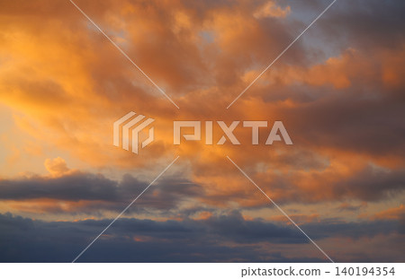 Sunset sky clouds orange and blue Sunset sky clouds orange and blue 140194354