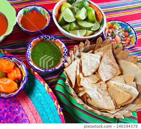 Mexican food varied chili sauces nachos lemon Mexican food varied chili sauces nachos lemon 140194378