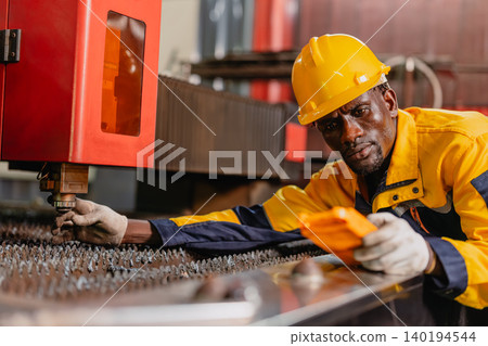 Professional African black engineer male technician expert worker control operate machine in plant Professional African black engineer male technician expert worker control operate machine in plant 140194544