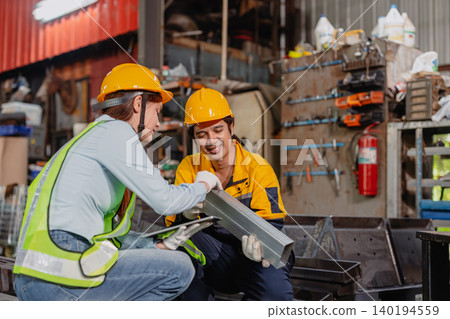 Professional worker man working in metal part workshop, Quality control staff looking product part. Professional worker man working in metal part workshop, Quality control staff looking product part. 140194559