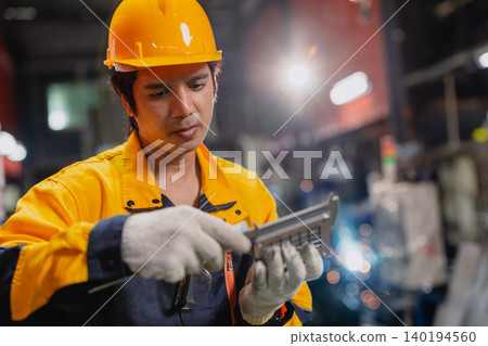 Professional Engineer male worker working check product quality measuring metal part with Vernier. Professional Engineer male worker working check product quality measuring metal part with Vernier. 140194560