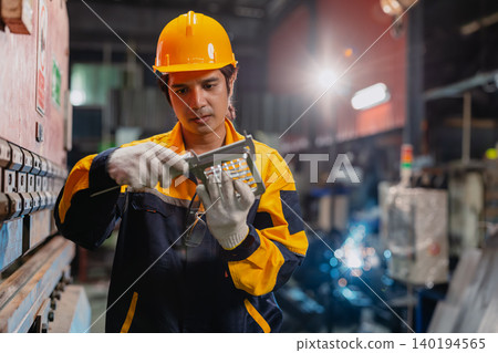 Professional Engineer male worker working check product quality measuring metal part with Vernier. Professional Engineer male worker working check product quality measuring metal part with Vernier. 140194565