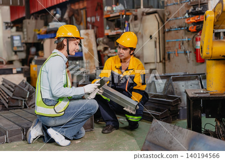 Professional worker man working in metal part workshop, Quality control staff looking product part. Professional worker man working in metal part workshop, Quality control staff looking product part. 140194566
