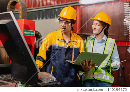 Engineers teamwork, Engineer man and woman team working together in metal workshop plant factory. Engineers teamwork, Engineer man and woman team working together in metal workshop plant factory. 140194573