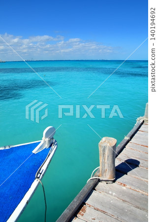 boat in wood pier Cancun tropical Caribbean sea 140194692