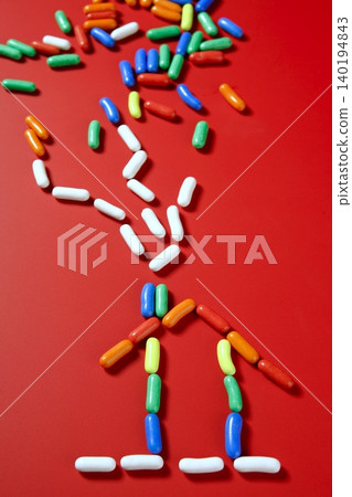 colorful candy on vivid red background colorful candy on vivid red background 140194843