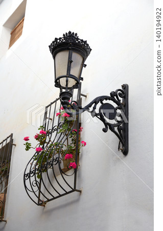 Benidorm white facade window with flowers pot 140194922