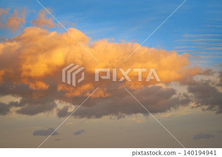 Sunset clouds in orange and blue sky Sunset clouds in orange and blue sky 140194941