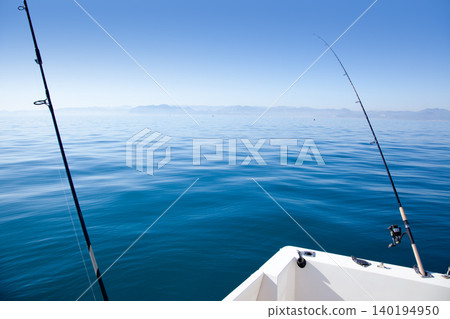 boat fishing rod in mediterranean blue sea boat fishing rod in mediterranean blue sea 140194950