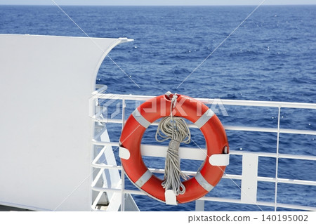 Cruise white boat handrail detail in blue sea Cruise white boat handrail detail in blue sea 140195002