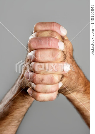 Hairy man hand closeup expression over gray Hairy man hand closeup expression over gray 140195045