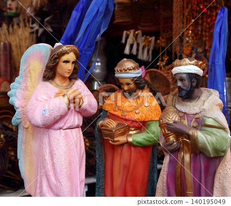 saint and virgin  figurines in mexican market 140195049