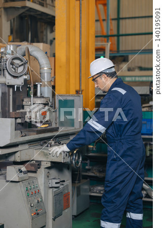 Engineer technician worker using Surface Grinding machine working in heavy metal industry Engineer technician worker using Surface Grinding machine working in heavy metal industry 140195091