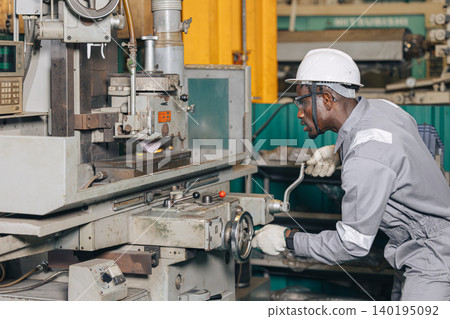 Engineer technician worker using Surface Grinding machine working in heavy metal industry Engineer technician worker using Surface Grinding machine working in heavy metal industry 140195092