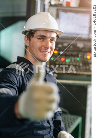 Happy Engineer male worker smiling with confident thumbs up vertical shot, Like Approved Confirm Happy Engineer male worker smiling with confident thumbs up vertical shot, Like Approved Confirm 140195102