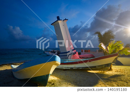 Puerto Morelos sunset bent lighthouse Puerto Morelos sunset bent lighthouse 140195180