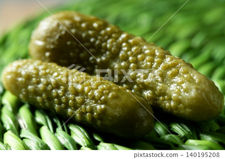 Green pickles macro studio shot, textured skin 140195208