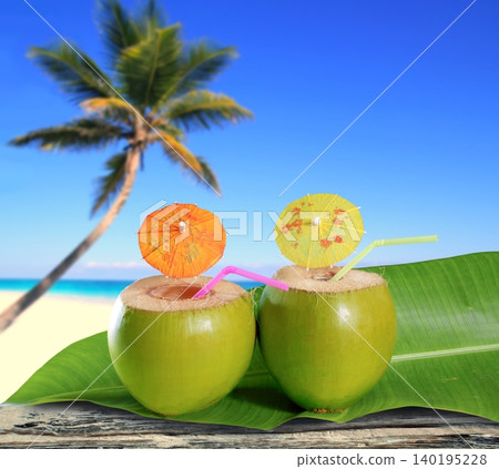 fresh coconuts straw cocktails tropical palm tree beach fresh coconuts straw cocktails tropical palm tree beach 140195228