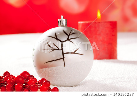 Christmas card of tree bauble and red candle Christmas card of tree bauble and red candle 140195257
