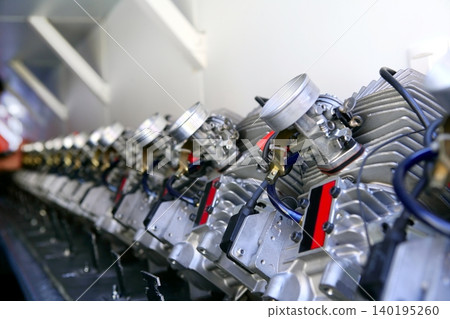 Engines from kart cars in row line for been inspected Engines from kart cars in row line for been inspected 140195260