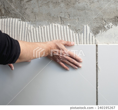 construction mason man hands on tiles work construction mason man hands on tiles work 140195267