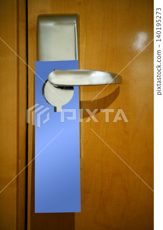 Hotel door handle with a copy space note Hotel door handle with a copy space note 140195273