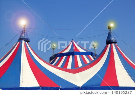 Circus tent under blue sky colorful stripes Circus tent under blue sky colorful stripes 140195287