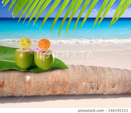 coconut cocktail in turquoise Caribbean beach coconut cocktail in turquoise Caribbean beach 140195333