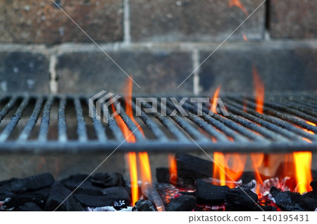 Bar b cue barbecue fire BBQ coal fire iron grill 140195431