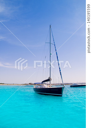 sailboat in turquoise beach of Formentera sailboat in turquoise beach of Formentera 140195599