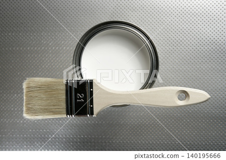 Painter brush and white paint tin 140195666