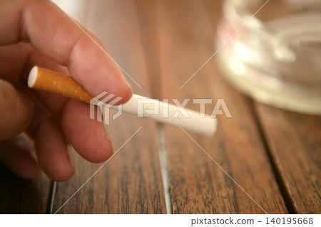 before lighting the cigarette 140195668